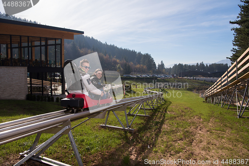 Image of couple enjoys driving on alpine coaster