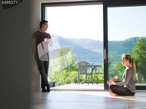 Image of couple on the door of their luxury home