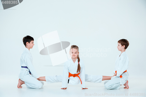 Image of The group of boys and girl at Aikido training in martial arts school. Healthy lifestyle and sports concept