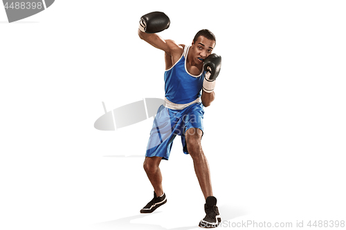 Image of Sporty man during boxing exercise making hit. Photo of boxer on white background