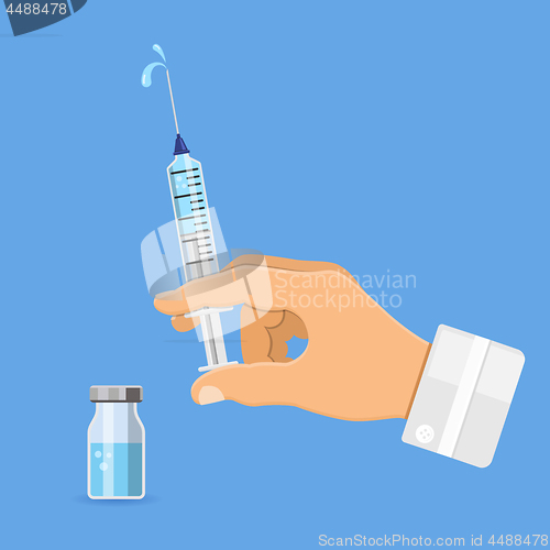 Image of Doctor holding syringe in hand