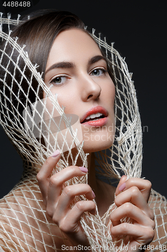 Image of Beautiful girl with net