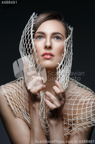 Image of Beautiful girl with net