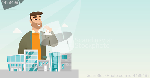 Image of Sales manager presenting city model.