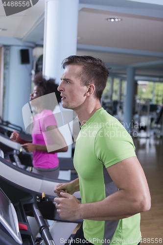 Image of people exercisinng a cardio on treadmill in gym