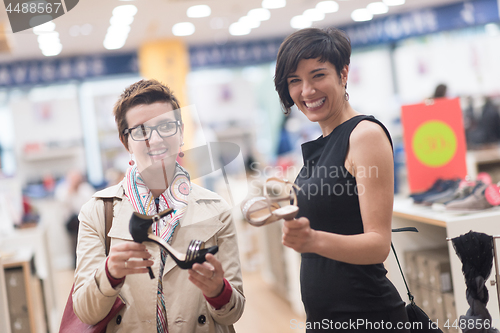 Image of best friend shopping in big mall