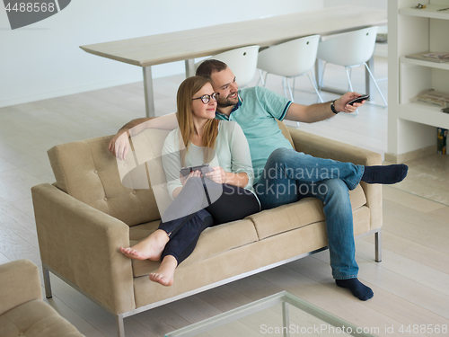 Image of couple relaxes in the living room