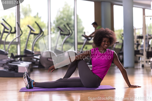 Image of african american woman exercise yoga in gym