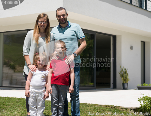 Image of happy family with children in the yard