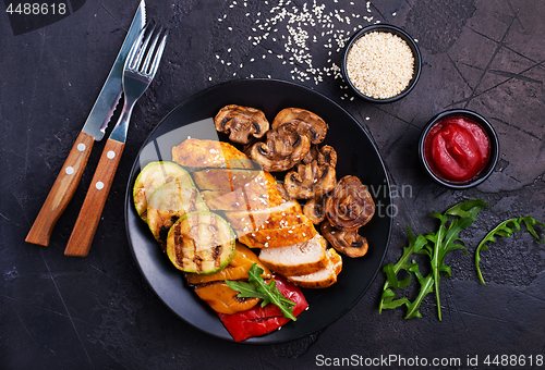 Image of chicken meat with grilled vegetables