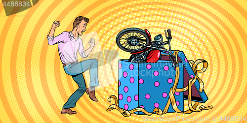 Image of Man and motorcycle holiday gift box, funny reaction joy.