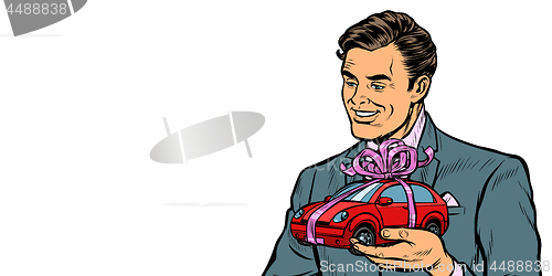 Image of Businessman gives a gift, selling cars. Isolate on white background
