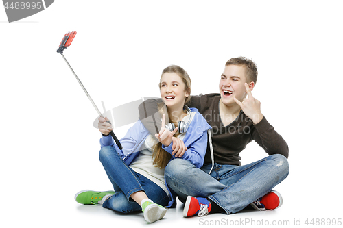 Image of Teen boy and girl taking selfie photo