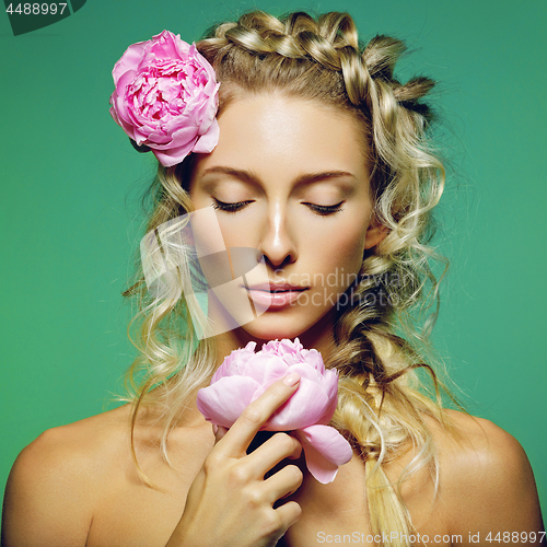 Image of Beautiful girl with peony flower