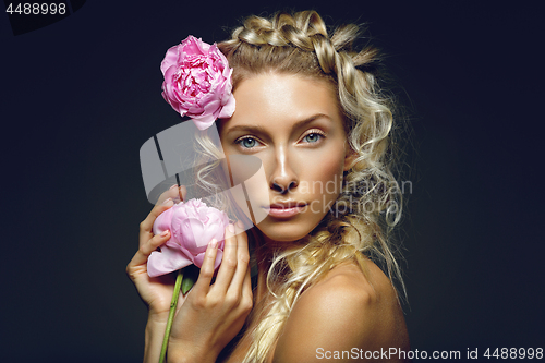 Image of Beautiful girl with peony flower