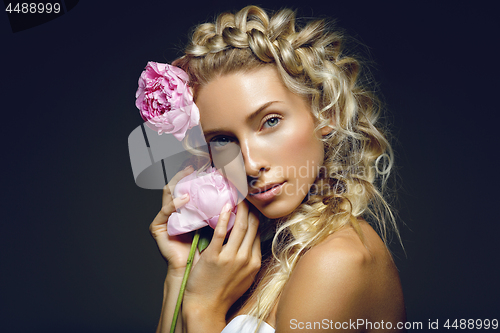 Image of Beautiful girl with peony flower