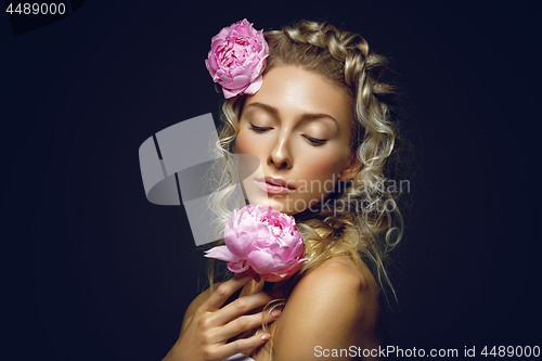 Image of Beautiful girl with peony flower