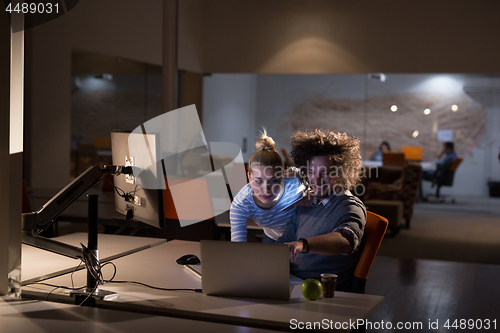 Image of young designers in the night office