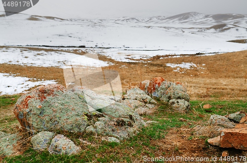 Image of Steppe with colorful stones at the winter mountains