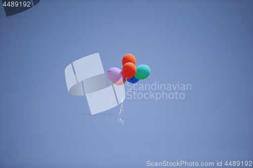 Image of Colorful balloons flying in the sky