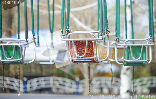 Image of Empty chain swing in amuzement park