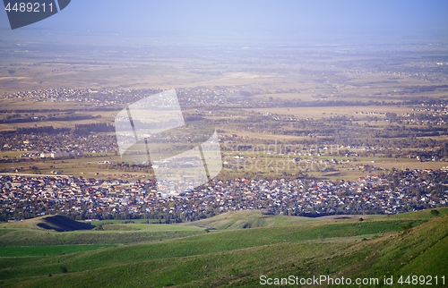 Image of High angle view onto the green fields and villages