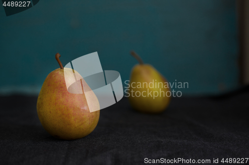 Image of Two fresh pears on a table