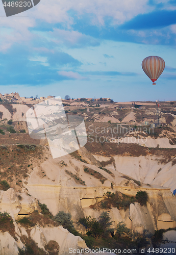 Image of Hot air balloon flying over the rocks of Cappadocia