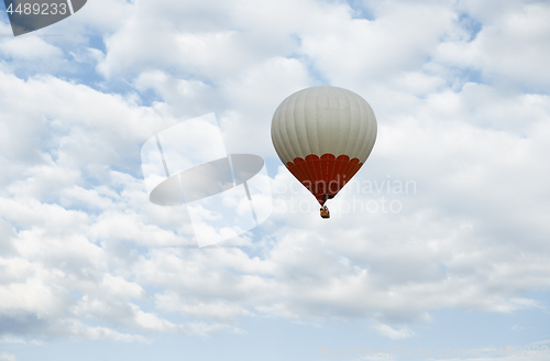 Image of One hot air balloon flying in the sky