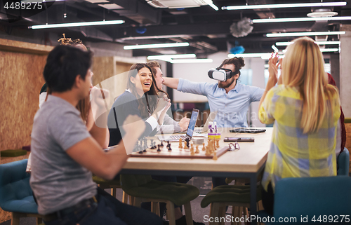 Image of Young Multiethnic Business team using virtual reality headset