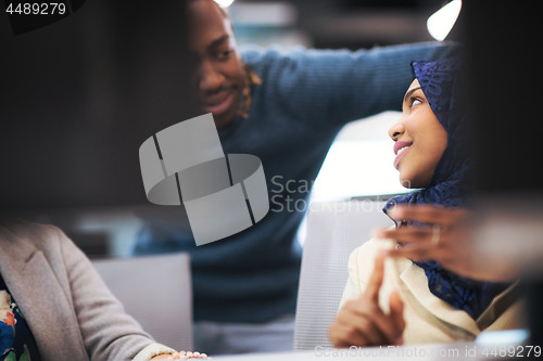 Image of black muslim female software developer at work