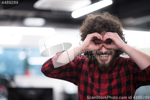 Image of Portrait of smiling male software developer