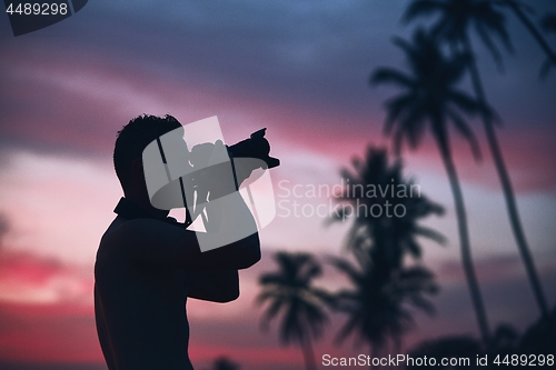 Image of Silhouette of the photographer at sunset