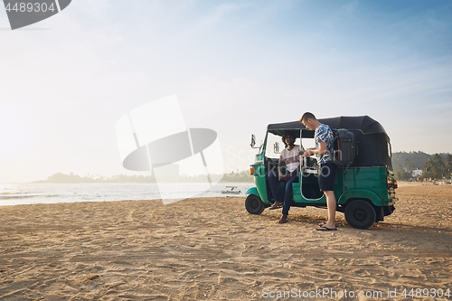 Image of Traveling by tuk tuk taxi