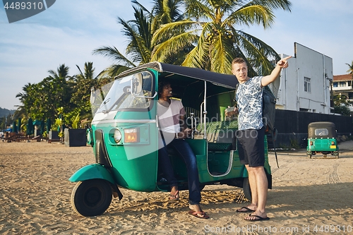 Image of Traveling by tuk tuk taxi