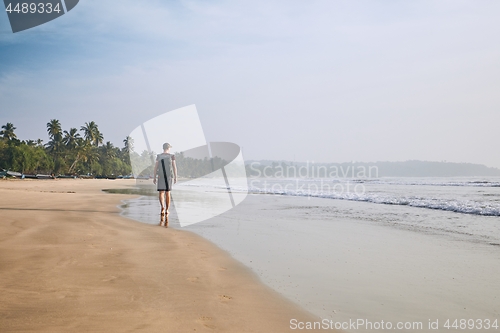 Image of Lonely man on the beach