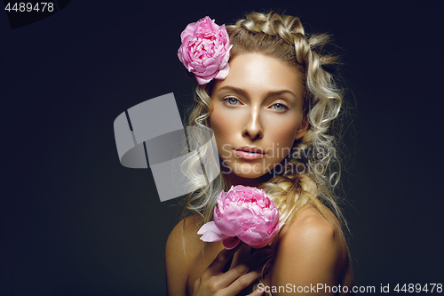 Image of Beautiful girl with peony flower