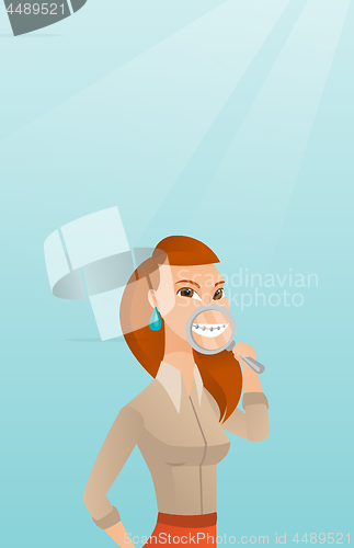 Image of Woman examining her teeth with a magnifier.