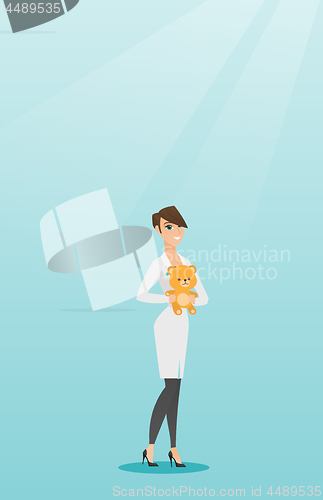 Image of Pediatrician doctor holding teddy bear.