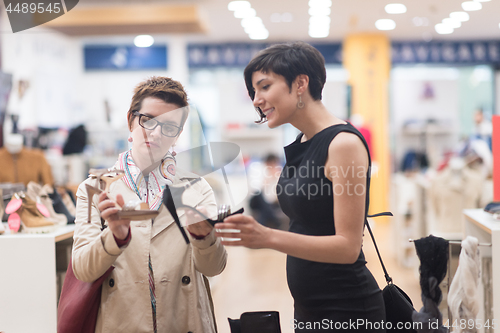 Image of best friend shopping in big mall