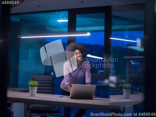 Image of black businesswoman using a laptop in startup office