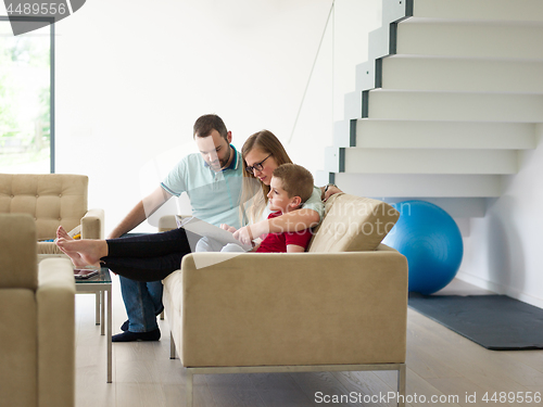 Image of family with little boy enjoys in the modern living room