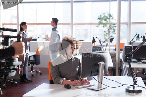 Image of businessman working using a computer in startup office