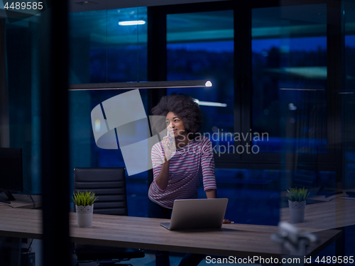 Image of black businesswoman using a laptop in startup office