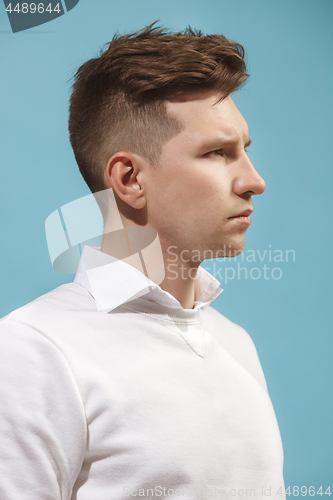 Image of Beautiful bored man isolated on studio background