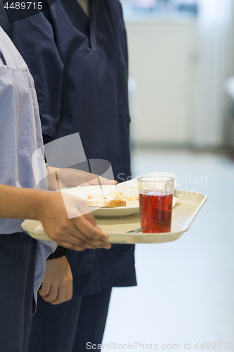 Image of Nurse Serving Lunch