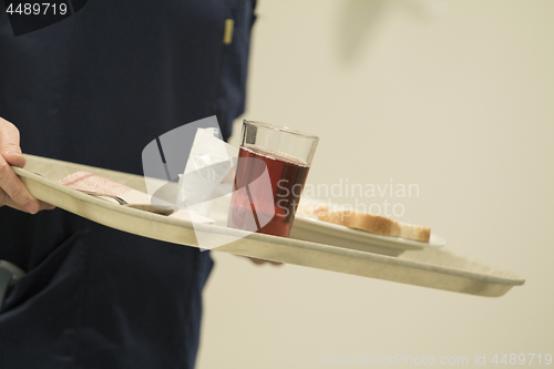 Image of Nurse Serving Lunch