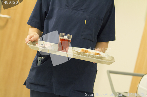 Image of Nurse Serving Lunch