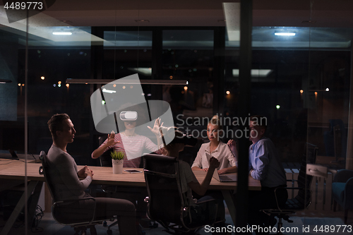 Image of Multiethnic Business team using virtual reality headset