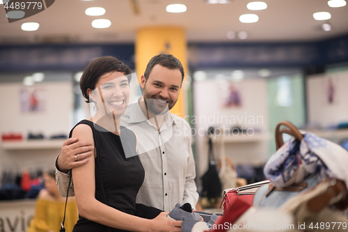 Image of couple chooses shoes At Shoe Store